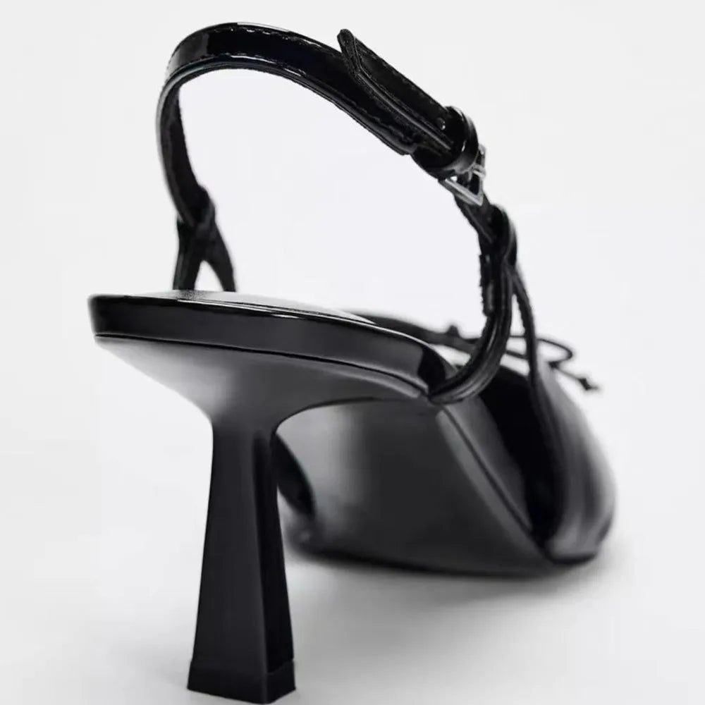 Black patent leather bow with pointed tip thin heel and a shallow strap for women's sandals - V.I.P Digital Presence
