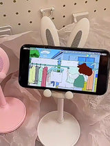 Soporte para teléfono móvil de escritorio con diseño de conejito de dibujos animados, ideal para estudiantes y personas perezosas.