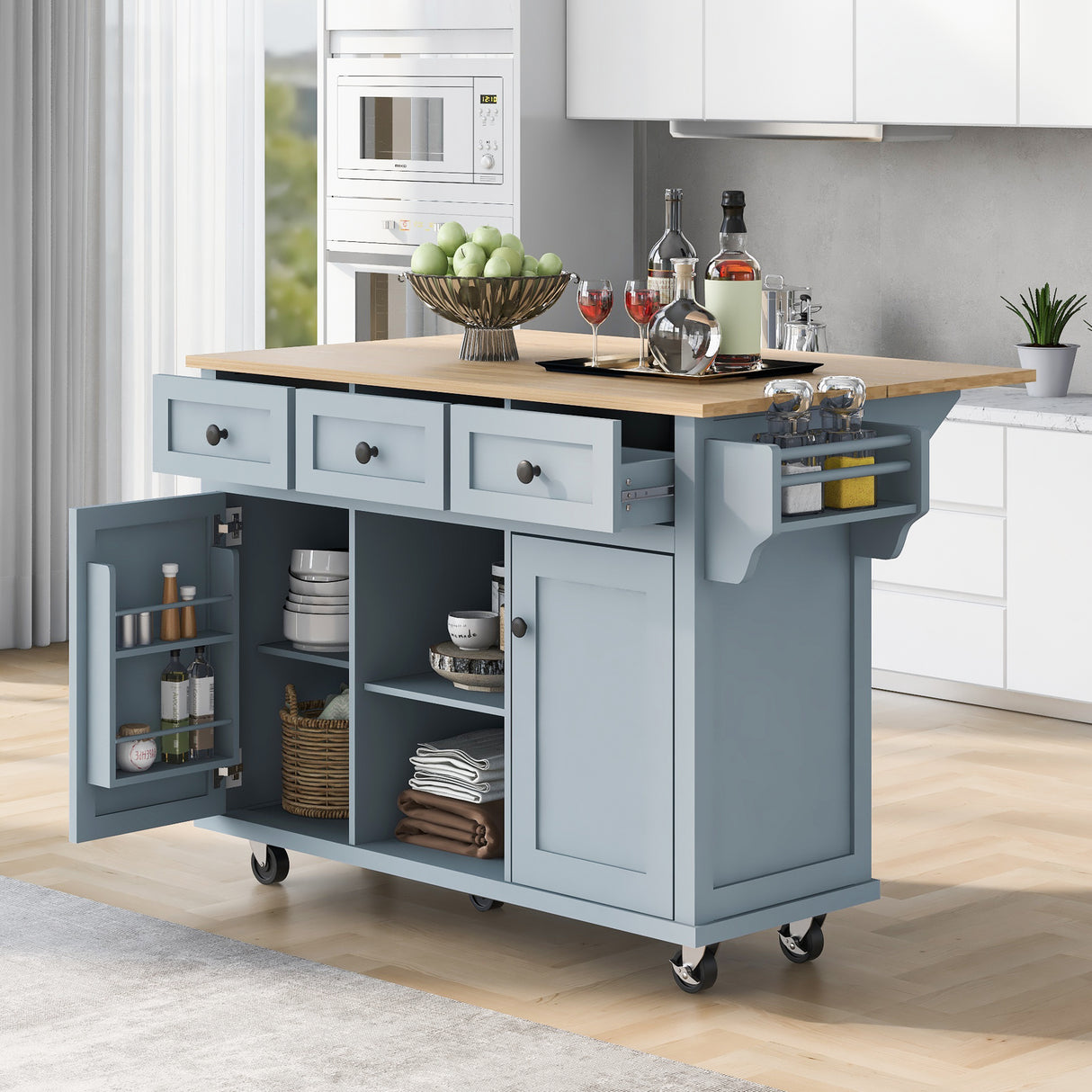 Kitchen handcart with rubber wood leaf countertop, storage cabinet, shelf, and 3 dining room drawers, gray blue - V.I.P Digital Presence