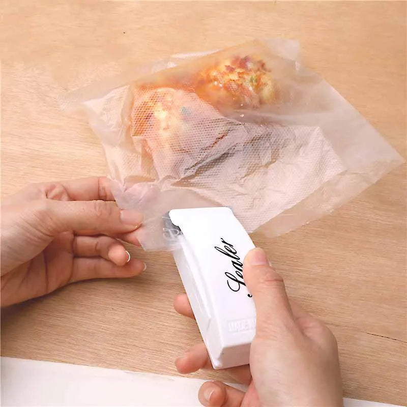 Mini sealing machine small household plastic sealing machine snack moisture-proof sealing machine - V.I.P Digital Presence