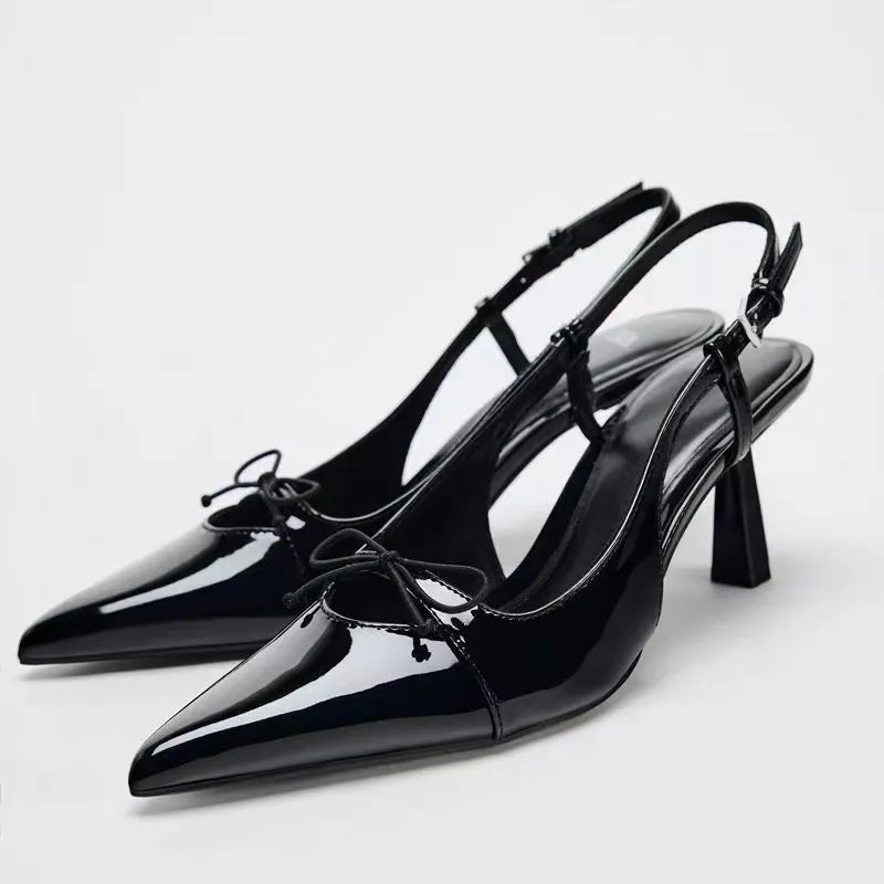 Black patent leather bow with pointed tip thin heel and a shallow strap for women's sandals - V.I.P Digital Presence