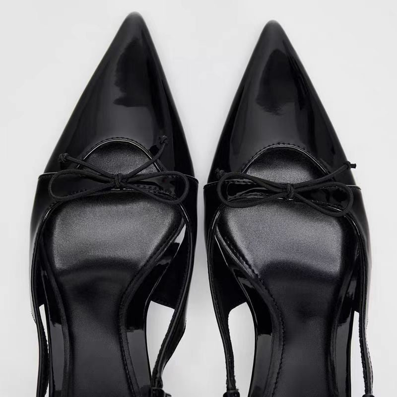Black patent leather bow with pointed tip thin heel and a shallow strap for women's sandals - V.I.P Digital Presence