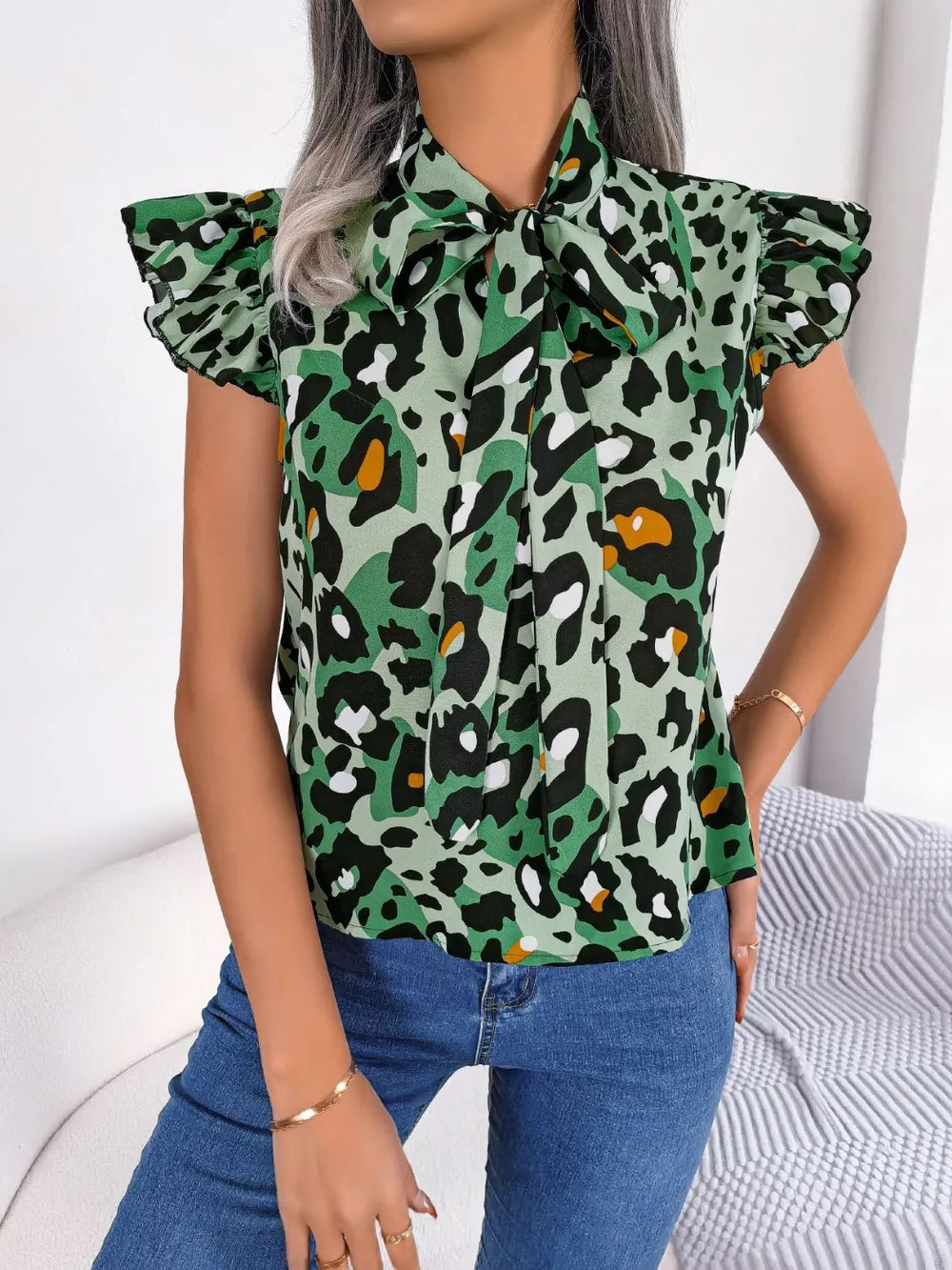 Leopard Tie Neck Cap Sleeve Blouse - V.I.P Digital Presence
