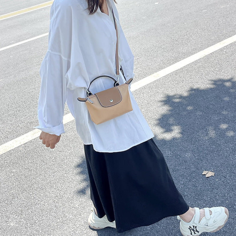 Retro fashion versatile women's bag, shoulder crossed, carrying high-end nylon dumpling bag - V.I.P Digital Presence